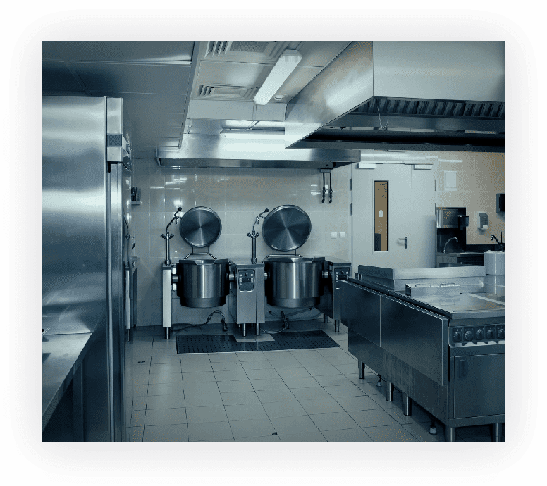 A kitchen with two large pots on the floor.