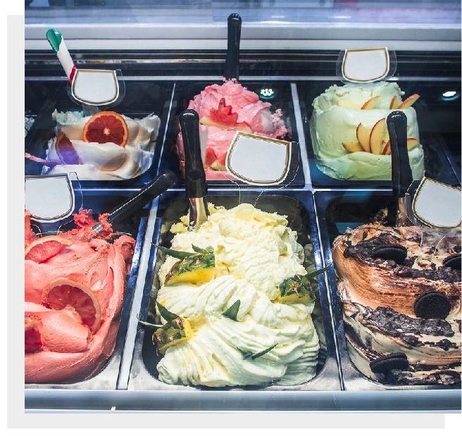 A display case filled with different types of ice cream.